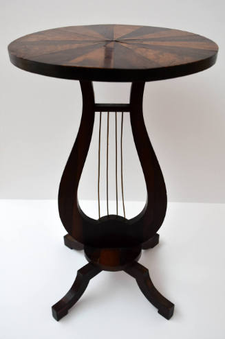 One of a pair of rosewood lyre-shaped side tables with circular top and four legs in the style …