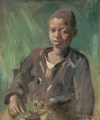 A portrait of a seated dark-skinned boy in a loose brown shirt and belted tan trousers.
