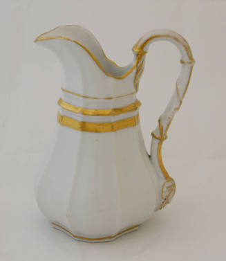 A cream pitcher from an Old Paris [Vieux Paris] porcelain tableware set in white with gold trim…