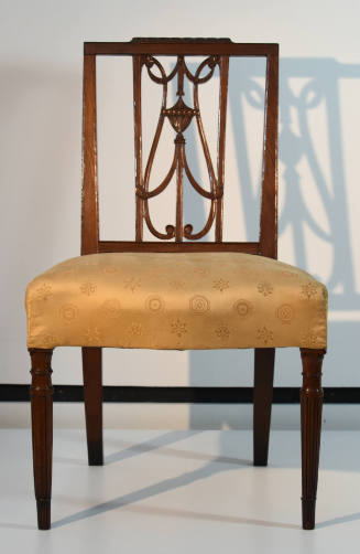 A mahogany side chair in the Sheraton style with an upholstered seat in gold damask, straight r…