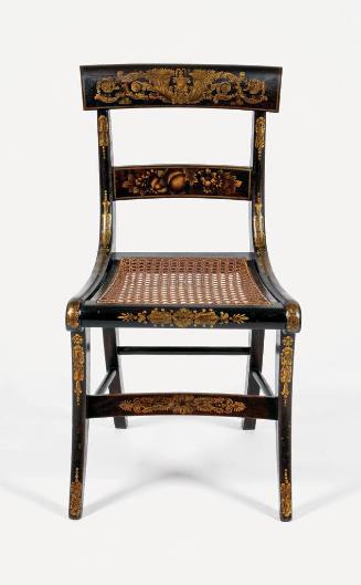 One of six klismos, cane-seated chairs from a suite of high-style, ebonized and rosewood-graine…