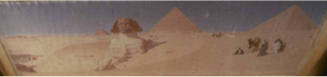 A painting of the Great Pyramids and Sphinx at Giza with a small band of figures on the right.