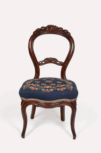 One of three side chairs with mahogany crest rails carved with fruit curving downwards into a p…
