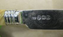 Maker's and date marks on the back of the knife blade.