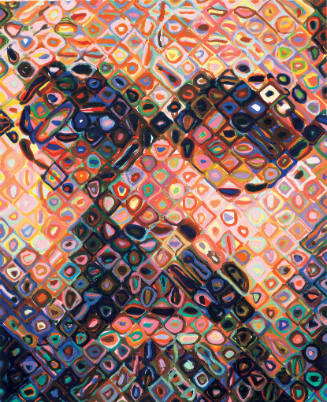 A self-portrait of artist, Chuck Close, composed of vibrant diamonds each with varying concentr…