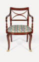 A mahogany armchair from a set of seven, each with a scroll back crest panel with carved thunde…