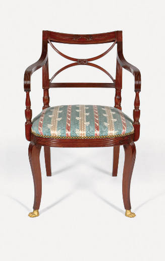 A mahogany armchair from a set of seven, each with a scroll back crest panel with carved thunde…