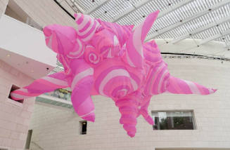 A free-form sculpture in varying hues of pink.