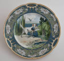 The third plate features a light blue rim with three clusters of white daisies and green leaves…