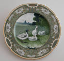 The fourth plate features a green rim with three clusters of white daisies and leaves alternati…