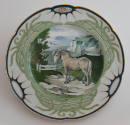 The eighth plate features a white and blue rim with three clusters of long green leaves alterna…