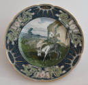 The twelfth plate features a blue rim with three clusters of pink flowers with long green leave…