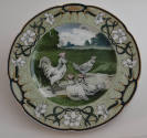 The fourteenth plate features a light green rim with three clusters of white flowers with long …