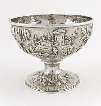 A silver waste bowl embellished with a repousse alpine scene.