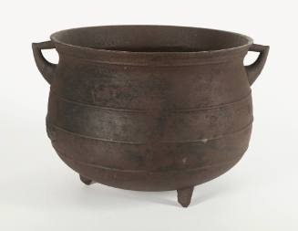 8-gallon cast iron pot on three legs with two handles.