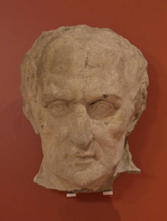 Relief of philosopher Aristotle's likeness with deep inset cheeks, long nose, furrowed brow, an…