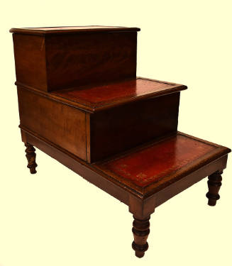 A three-tiered Regency-style mahogany library steps with four turned feet and a hinged lid on t…