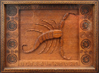 A relief carving of a scorpion. 