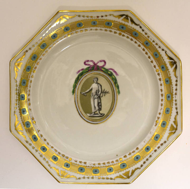 One of twelve octagonal plates with a sculptural figure inside an ovoid roundel crowned with a …