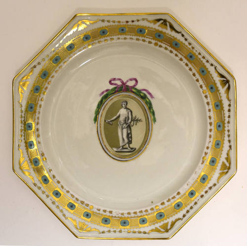 One of twelve octagonal plates with a sculptural figure inside an ovoid roundel crowned with a …