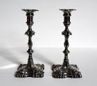 A pair of George III cast sterling silver candlesticks with removable bobeches. 