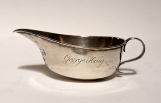 A silver pap boat with an ovoid bowl with spout roll over lip and applied reeded handle.