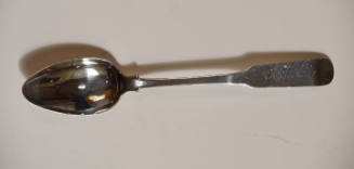 A slender fiddle handle spoon.