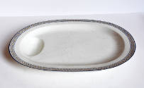 An oval platter from a fifty-one-piece dinner service of Wedgwood Queen's ware in cream with a …
