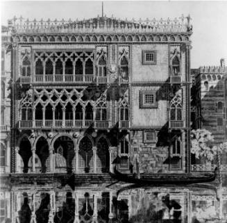 A heavily ornamented Venetian building mirrored in the glassy surface of the canal in the foreg…