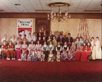 A group of twins standing together.