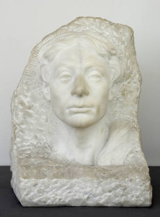 Portrait of poet John Keats, his face and neck emerging from a roughly carved block of marble.