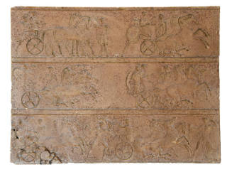 A rectangular block with three registers of chariot riders. 