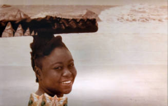 A girl with a horizontal bar-like hairdo with fish decoration. 