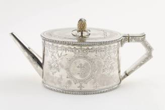 A Victorian sterling silver teapot with a finely engraved cartouche depicting a heraldic cross,…