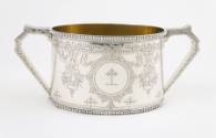 A Victorian sterling silver sugar bowl with a finely engraved cartouche depicting a heraldic cr…