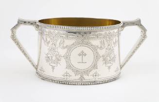 A Victorian sterling silver sugar bowl with a finely engraved cartouche depicting a heraldic cr…