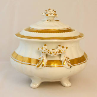 A side view of the sugar bowl showcasing the handle.