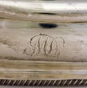 Monogram "ML" on the side of the bowl. 