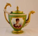 A green porcelain teapot with a gold framed portrait of Pauline Bonaparte on the body, gold zoo…