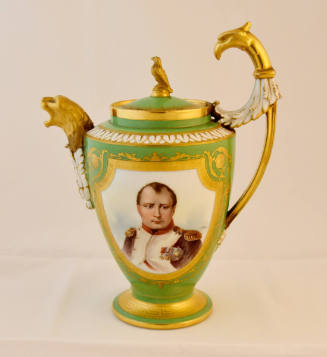 A green porcelain coffeepot with a gold framed portrait of Napoleon I on the body, gold zoomorp…