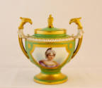 A green porcelain sugar bowl with a gold framed portrait of a noble woman on the body, gold zoo…