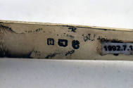 Maker's marks stamped on the interior of the arm. 