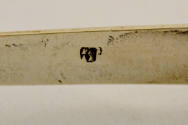 Hallmark stamped on the interior of the arm. 