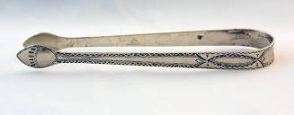 A sterling silver sugar tongs with oval-shaped tips, the arms engraved with brightwork design a…