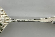 Maker's marks on the back of the handle stem.