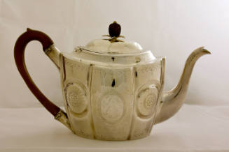 Sterling silver ovoid teapot with fluted, brightwork decorated panels, a hinged lid, and wood f…