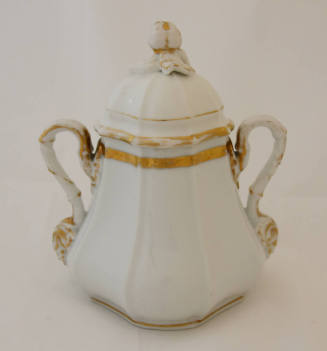 A sugar bowl from an Old Paris [Vieux Paris] porcelain tableware set in white with gold trim. 