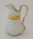 A cream pitcher from an Old Paris [Vieux Paris] porcelain tableware set in white with gold trim…