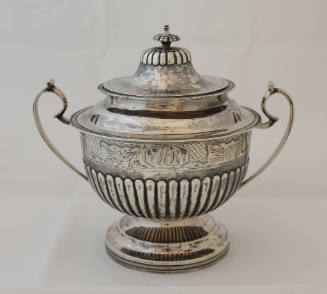 A circular, demi-fluted sugar bowl with gadrooned trim, one-inch band of bright-cut engraving, …