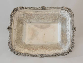An English, rectangular silver-plate cake basket with an ornately chased foliate rim.